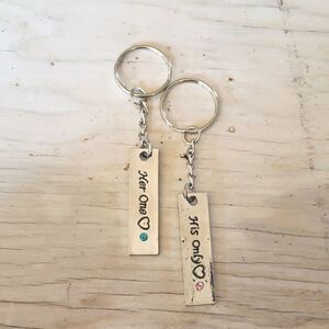 Key rings, his and hers, silvertone